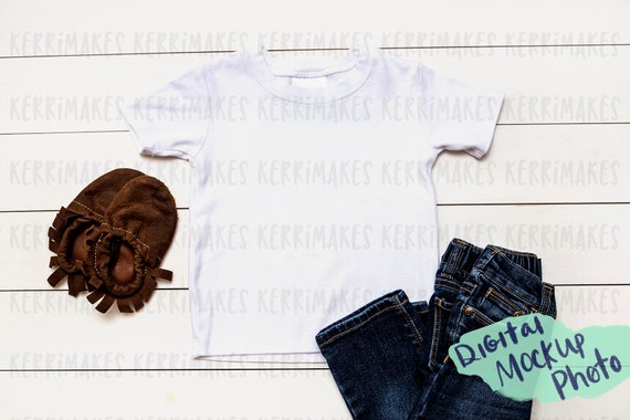 Mockup Photo Of White Toddler T-Shirt With Moccs Digital