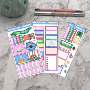 May include: Three sheets of colourful planner stickers featuring candy-themed illustrations, including jelly beans, a green weekend banner, and daily headers. The stickers are arranged in rectangular grids with various shapes, hearts, and checkboxes.