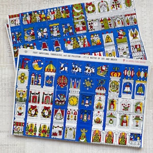 Può includere: Due fogli di francobolli natalizi blu con varie illustrazioni, tra cui angeli, campane e Babbo Natale. I francobolli riportano la scritta "GREETINGS 1979" e "FIGHT EMPHYSEMA, TUBERCULOSIS, and AIR POLLUTION - IT'S A MATTER OF LIFE AND BREATH".