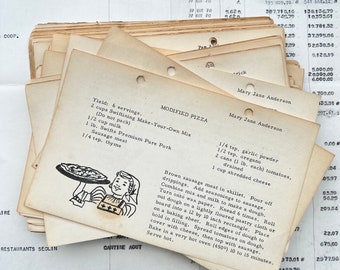 May include: A vintage recipe card for a modified pizza recipe. The card features a cartoon illustration of a girl holding a pizza. The recipe calls for 2 cups of Swiftining Make-Your-Own Mix, 1/2 cup of milk, 1 lb. of Swift's Premium Pure Pork Sausage meat, 1/4 tsp. of garlic powder, 1/2 tsp. of oregano, 2 cans of drained tomatoes, 1 cup of shredded cheese, and 1/4 tsp. of thyme.