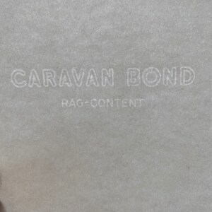 May include: White text on a gray background reads "CARAVAN BOND" and "RAG-CONTENT".