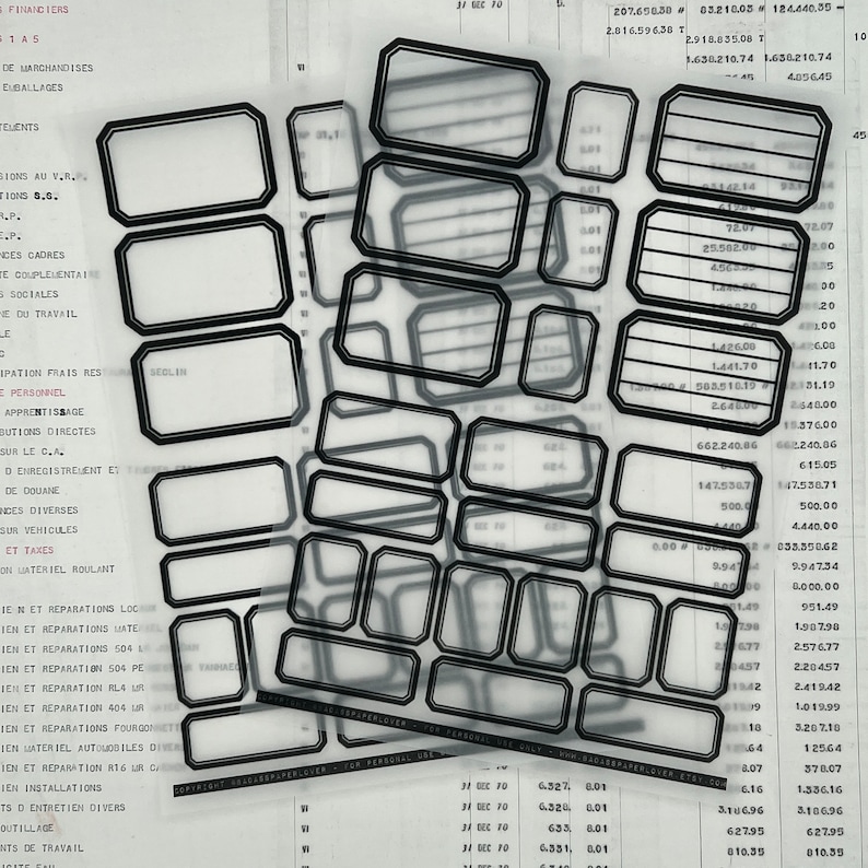 May include: A black and white image of a sheet of paper with multiple black rectangular boxes. The boxes are arranged in a grid pattern and are overlapping. The boxes are all the same size and shape. The paper is covered in text and numbers.