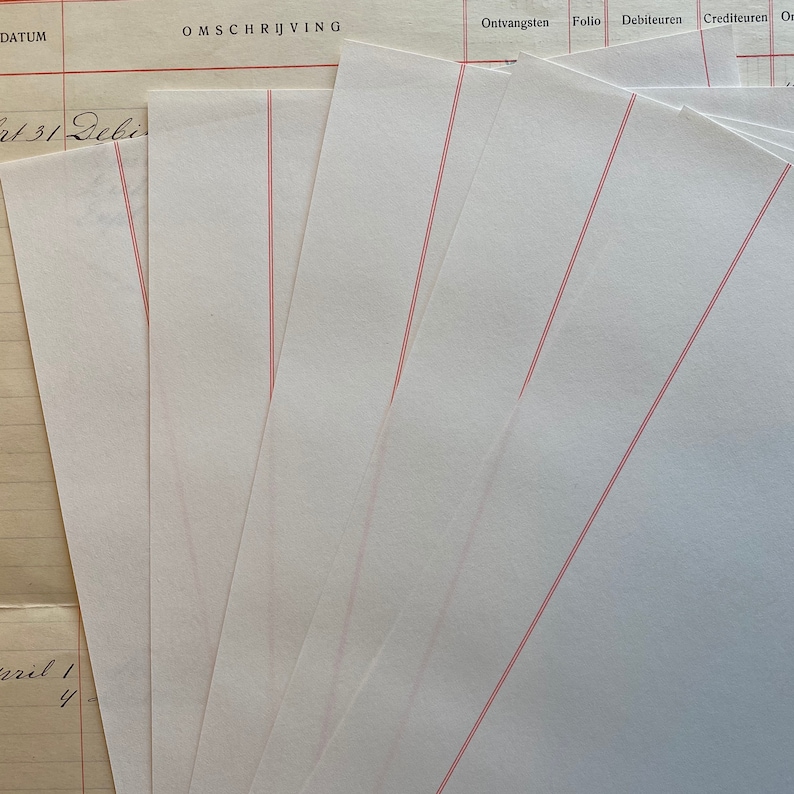 May include: A close-up of a blank ledger page with red lines. The page is part of a larger ledger book with the words "OMSCHRIJVING", "Ontvangsten", "Folio", "Debiteuren", and "Crediteuren" printed at the top.