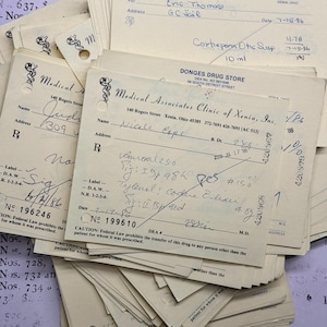 Vintage doctors prescriptions from the 1980&#39;s, yellow medicine doctor&#39;s prescriptions