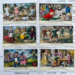 Vintage-Sammelkarten. Set mit 6 alten Karten der Firma Liebig, Werbe-Sammelkarten. Serie 533 Kinderspiele