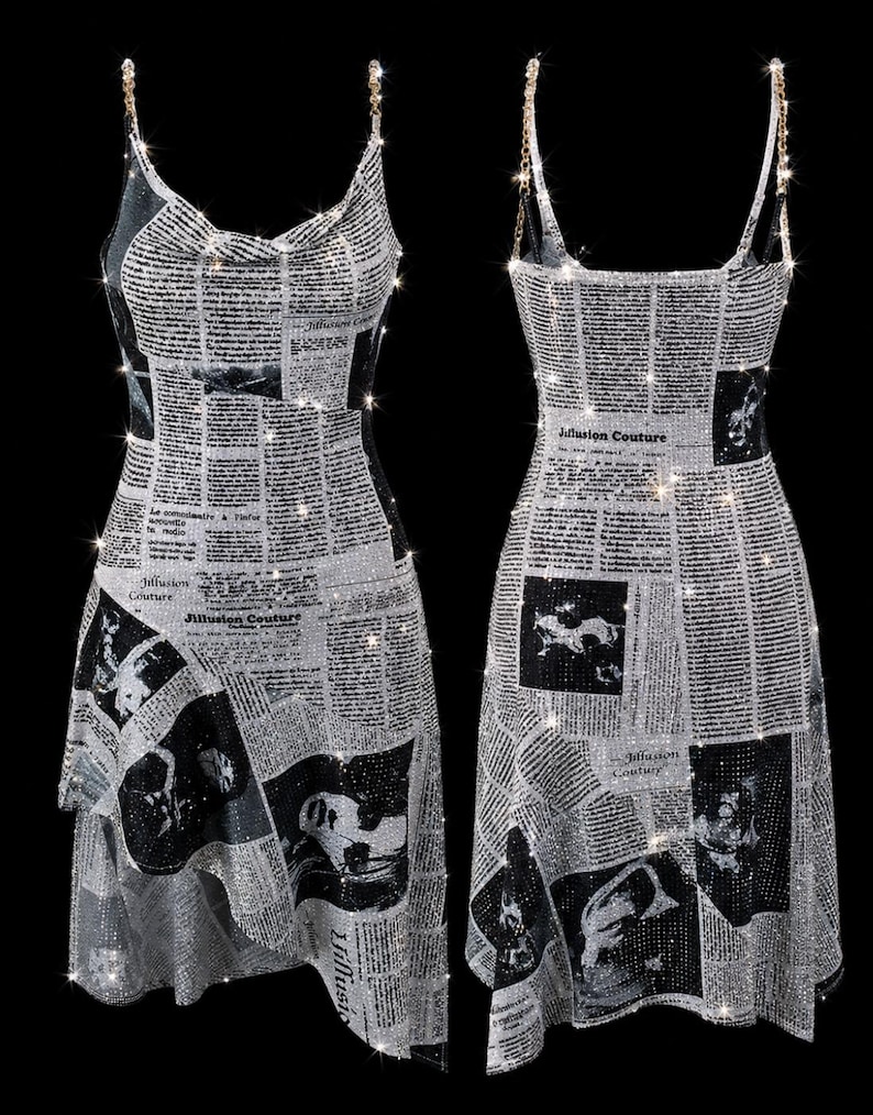 May include: A sleeveless dress featuring a newspaper print pattern with black text and images on a silver, sparkling background. The garment has a cowl neckline, thin chain straps, and an asymmetrical hemline with the text Jillusion Couture.