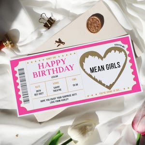 May include: Pink and gold birthday ticket with the text "Happy Birthday" and "Mean Girls" with a scratch-off area. The ticket says "Admit One" and has a date, venue, and time.