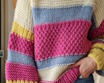 Chunky hand knitted colorful sweater. Cozy and warm striped knit jumper. Christmas gift
