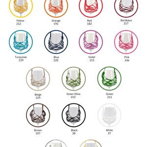 May include: A chart showing 16 different colors of wine glass charms. The colors are yellow, orange, red, turquoise, blue, violet, pink, beige, green olive, green, brown, black, white, silver, and gold. Each color is represented by a circle with a wine glass charm inside.