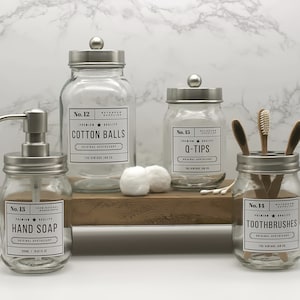 Accessoires de salle de bains en verre Jar Co. vintage Distributeur de savon à main Porte-brosse à dents Pot en boule de coton Pot pour Q-Tips Acier inoxydable Set of 4