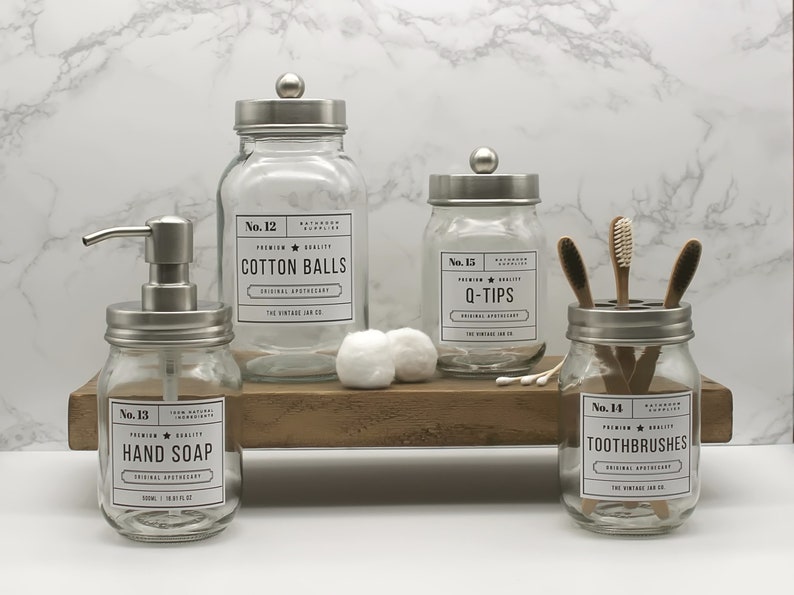 Accessoires de salle de bains en verre Jar Co. vintage Distributeur de savon à main Porte-brosse à dents Pot en boule de coton Pot pour Q-Tips Acier inoxydable Set of 4