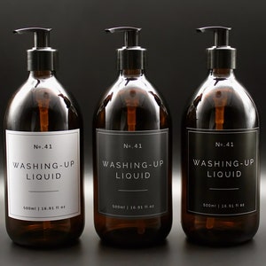 May include: Three amber glass bottles with black pump tops and black and white labels. The labels read "No. 41 WASHING-UP LIQUID 500ml | 16.91 fl oz".