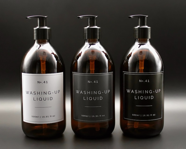 May include: Three amber glass bottles with black pump tops and black and white labels. The labels read "No. 41 WASHING-UP LIQUID 500ml | 16.91 fl oz".