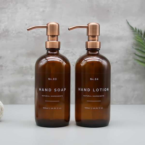 Amberkleurige glazen navulbare fles zeepdispenser: koperen metalen pomp, handzeep, lotion