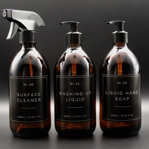 May include: Three amber glass bottles with black labels and white text. The bottles are labeled "No. 40 Surface Cleaner", "No. 41 Washing-Up Liquid", and "No. 42 Liquid Hand Soap". Each bottle contains 500 ml or 16.91 fl oz.