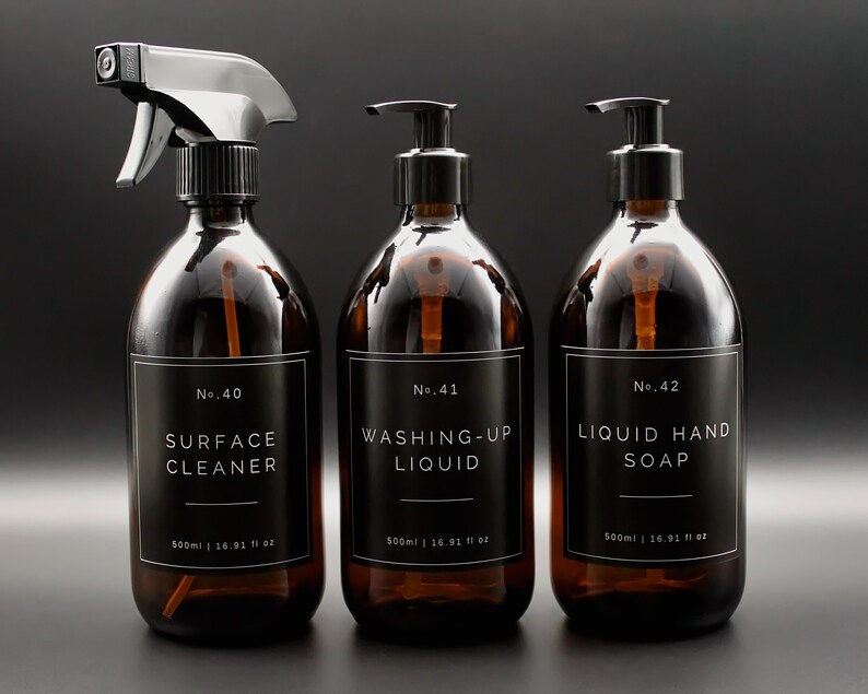 May include: Three amber glass bottles with black labels and white text. The bottles are labeled "No. 40 Surface Cleaner", "No. 41 Washing-Up Liquid", and "No. 42 Liquid Hand Soap". Each bottle contains 500 ml or 16.91 fl oz.