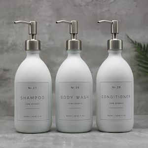 May include: Three white bottles with silver pumps and labels. The bottles are labelled "No. 27 Shampoo 100% Organic", "No. 28 Body Wash 100% Organic", and "No. 29 Conditioner 100% Organic". Each bottle contains 500 ml (16.91 fl oz).