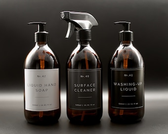 May include: Three amber glass bottles with black pump tops and labels. The labels are white with black text. The bottles are labeled "No. 42 LIQUID HAND SOAP", "No. 40 SURFACE CLEANER", and "No. 41 WASHING-UP LIQUID". Each bottle contains 500 ml or 16.91 fl oz.