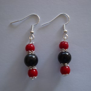 pair of red and black earrings, nickel-free silver hook, black obsidian bead, red coral bead