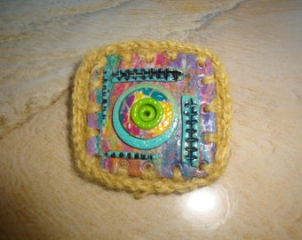 brooch made in 3D polymer, outline made with wool crochet, diameter of the brooch 5 centimeters