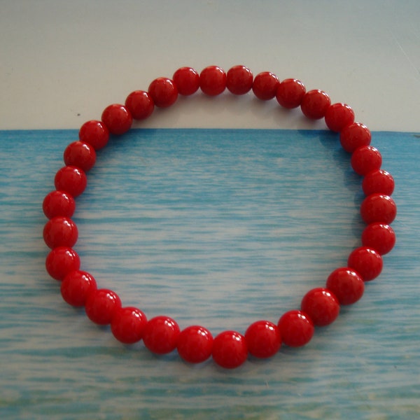 bracelet de couleur corail rouge  taille élastique perle ronde 6 mm