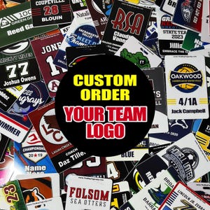 May include: A collection of rectangular plastic bag tags featuring various sports team logos, player names, and jersey numbers. A large black circular overlay in the center displays the yellow and red text CUSTOM ORDER YOUR TEAM LOGO.