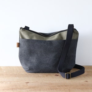 Sac à bandoulière arrondi en toile délavée pour homme et femme. Sac à main en toile décontracté pour un usage quotidien.