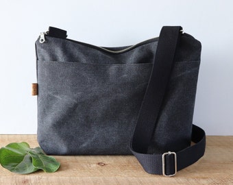 Large Stonewashed Crossbody Bag for women and men. Casual Canvas Purse with wide shoulder strap and exterior pocket.