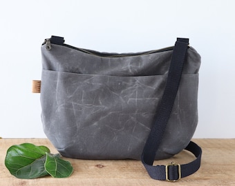 Waxed Canvas Crossbody Bag: Rounded Design with Zipper