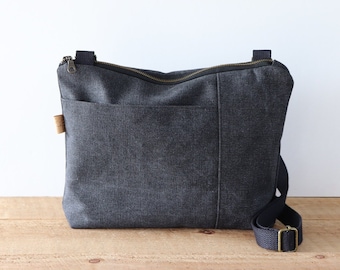 Bolso bandolera de lona lavada a la piedra para mujer y hombre. Monedero casual de lona para uso diario, con cremallera superior y bolsillo exterior frontal.