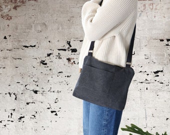 Stonewashed Canvas Crossbody Bag for women and men. Casual Canvas Purse for everyday use, with top zipper and front exterior pocket.