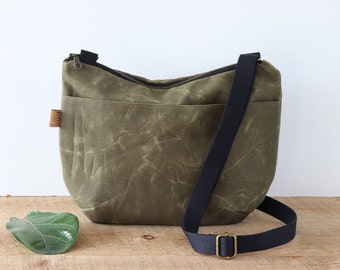 Slouchy Waxed Canvas Crossbody Bag for women and men, with top zipper and exterior pocket.Rugged Waxed Canvas Bag for outdoors and travel.