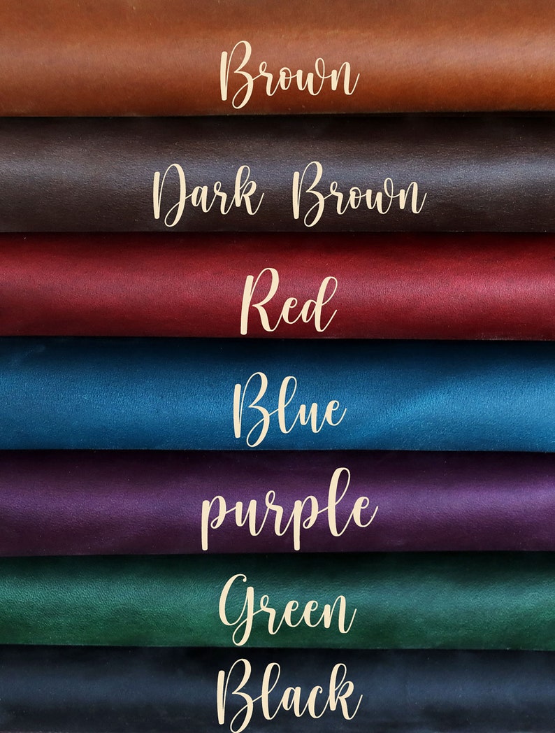 May include: A close-up of eight swatches of leather in various colors. The colors include brown, dark brown, red, blue, purple, green, and black. Each swatch has the color name written in cursive.