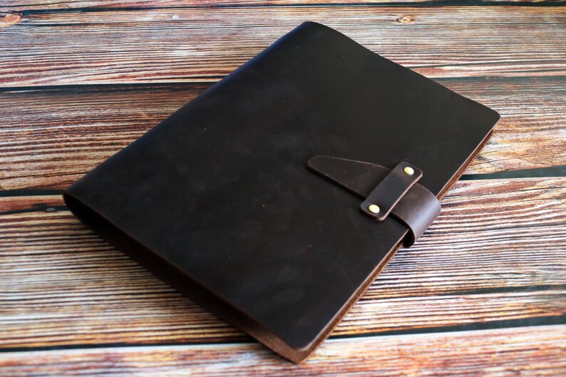 May include: A set of three ceramic mugs with a speckled, matte finish. The mugs are in shades of cream, light brown, and dark brown. Each mug has a simple, minimalist design and a rounded handle.