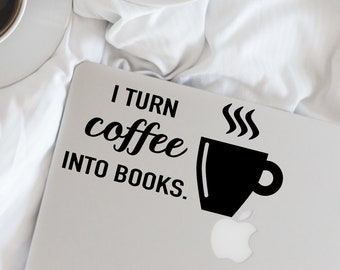 May include: A white laptop with a black sticker that says "I turn coffee into books." The sticker features a black coffee cup with steam coming from it.