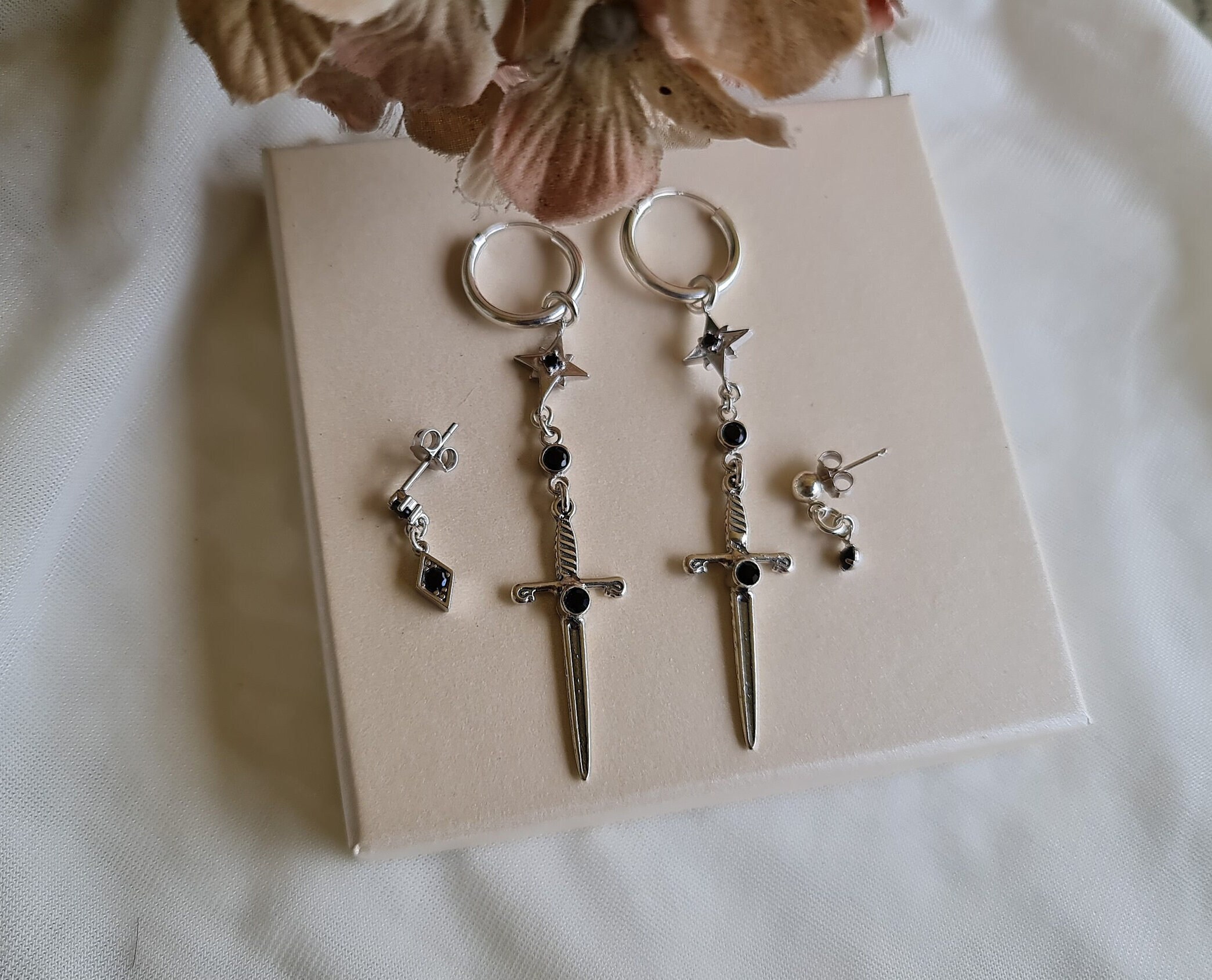 Dangling sword earring clearance