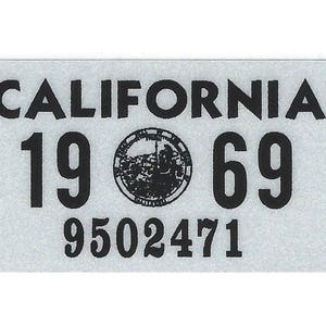 May include: A gray California license plate with black text and a seal. The plate reads "CALIFORNIA 19 69 9502471".