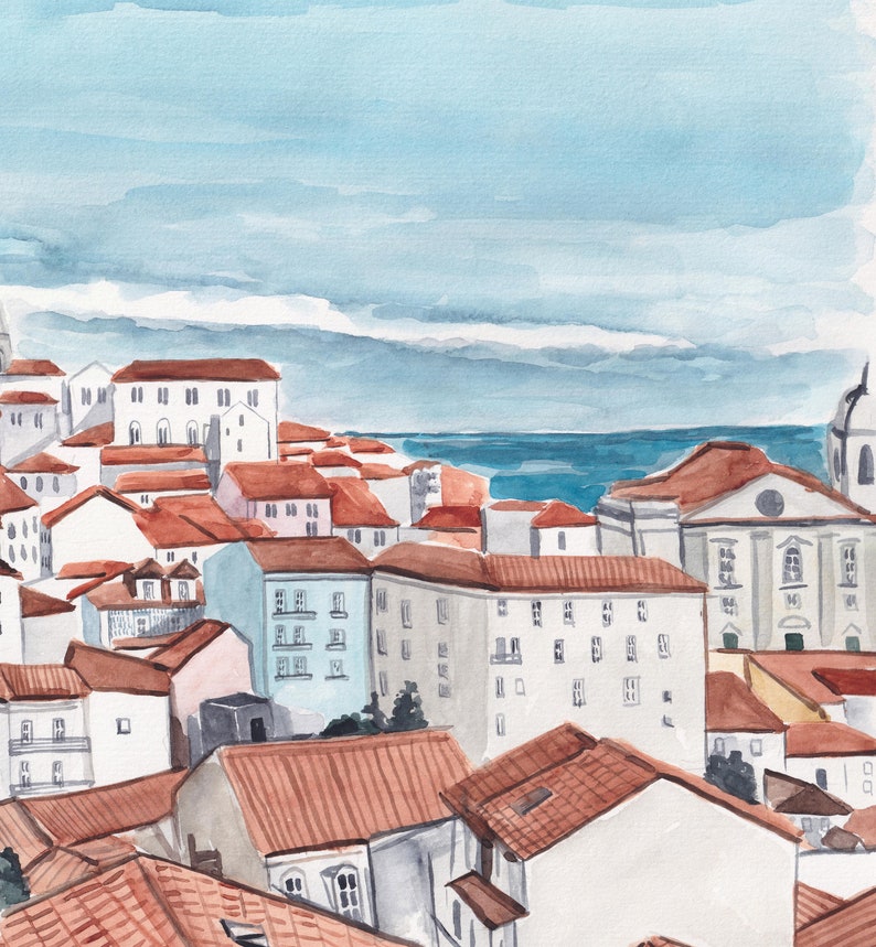 May include: Watercolor painting of a cityscape with red tile roofs and white buildings. The buildings are clustered together and there is a body of water in the distance. The sky is a light blue with white clouds.