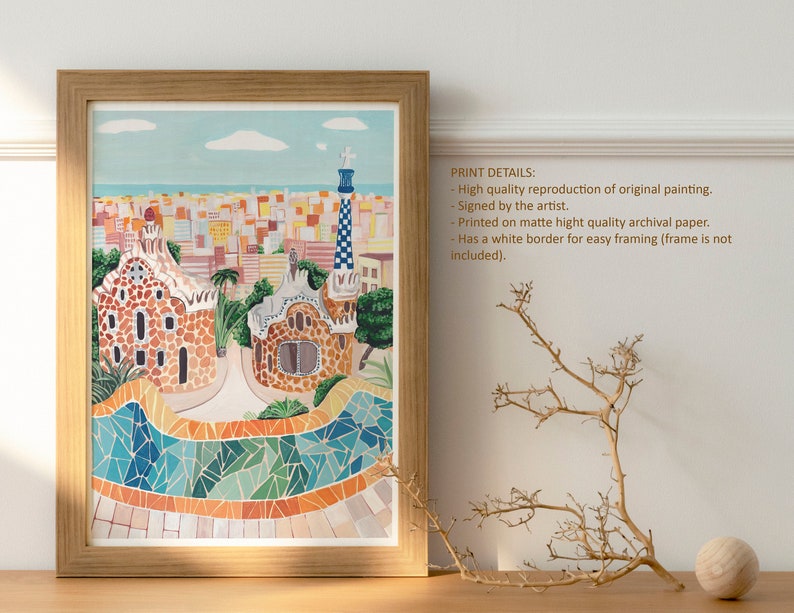 May include: A colorful illustration of Park G&uuml;ell in Barcelona, Spain. The print features a mosaic design and a view of the city skyline. The print is framed in a light wood frame.