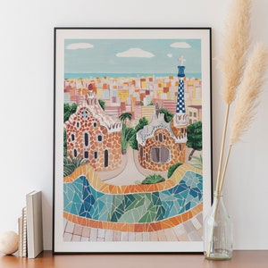 May include: A framed illustration of a colorful cityscape with a mosaic tiled pathway and a building with a unique architectural design. The illustration is in a black frame and is hanging on a white wall.