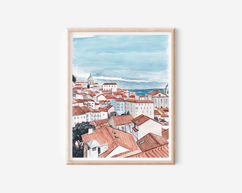 May include: A watercolor painting of a cityscape with red-tiled roofs and a blue sky. The city is built on a hill and overlooks the ocean.