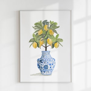 May include: A watercolour painting of a lemon tree in a blue and white porcelain vase. The tree has green leaves and yellow lemons.
