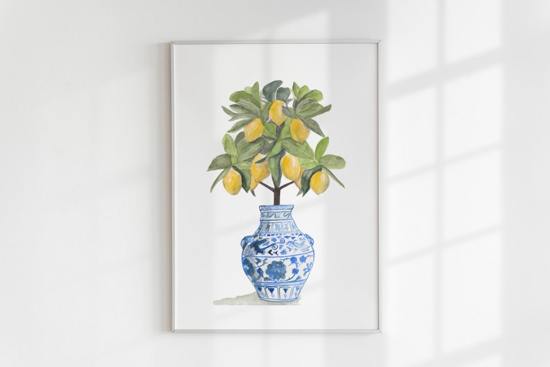 May include: A watercolour painting of a lemon tree in a blue and white porcelain vase. The tree has green leaves and yellow lemons.