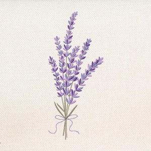 May include: An embroidered bouquet of lavender flowers in shades of purple and green, tied with a purple ribbon. The design is on a cream-colored fabric with a textured appearance. The Golden Pineapple logo is in the lower left corner.