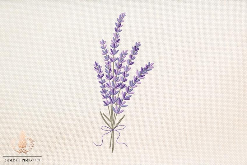 May include: An embroidered bouquet of lavender flowers in shades of purple and green, tied with a purple ribbon. The design is on a cream-colored fabric with a textured appearance. The Golden Pineapple logo is in the lower left corner.