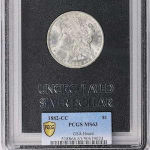 1882-CC Morgan Silver Dollar-PCGS MS-63-official Gsa holder and Coa-Mint Gsa box. Many Gsa CCs exist but these are also certified by Pcgs.