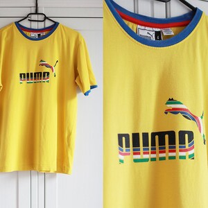 Yellow vintage puma shirt 2025