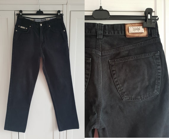 BOSS - Tapered-fit jeans in black supreme-movement denim