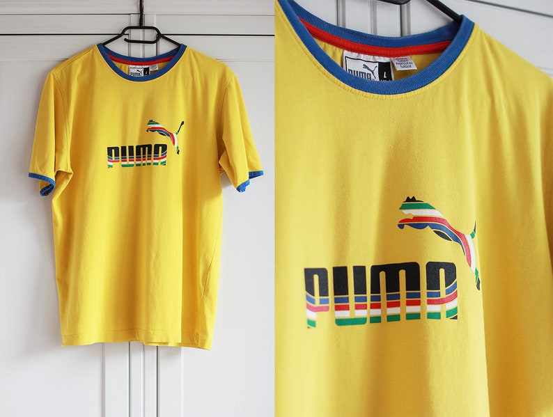 red blue yellow puma shirt