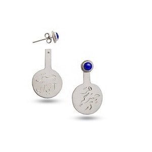 May include: A pair of silver earrings with a blue stone and a circular design. The earrings are dangle style and have a post back.